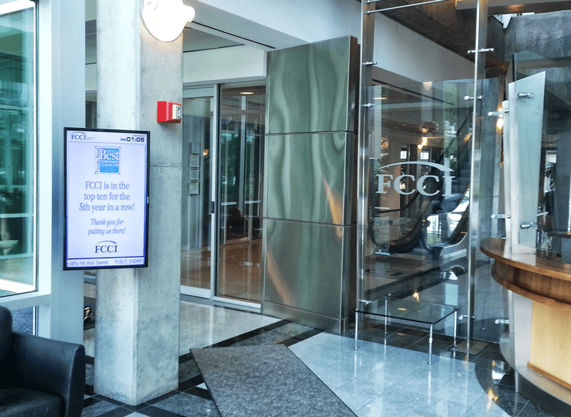 Portrait digital signage screen in the lobby of the FCCI Insurance Group headquarters